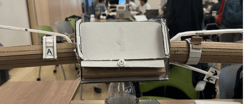 Angled dashboard screen and power button below the screen space. Dashboard screen is cut out leaving room for the phone to simulate the actual screen.