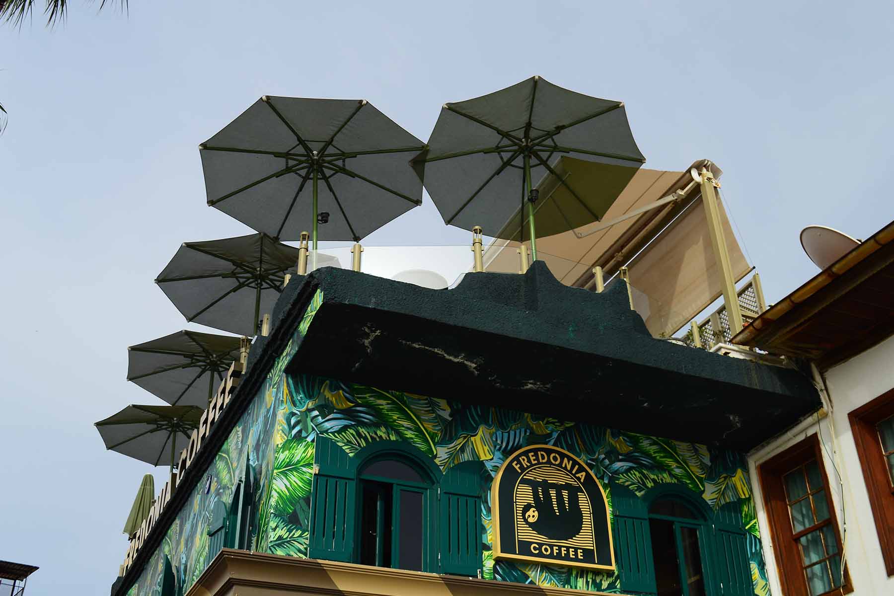 two people looking at a tablet and smiling