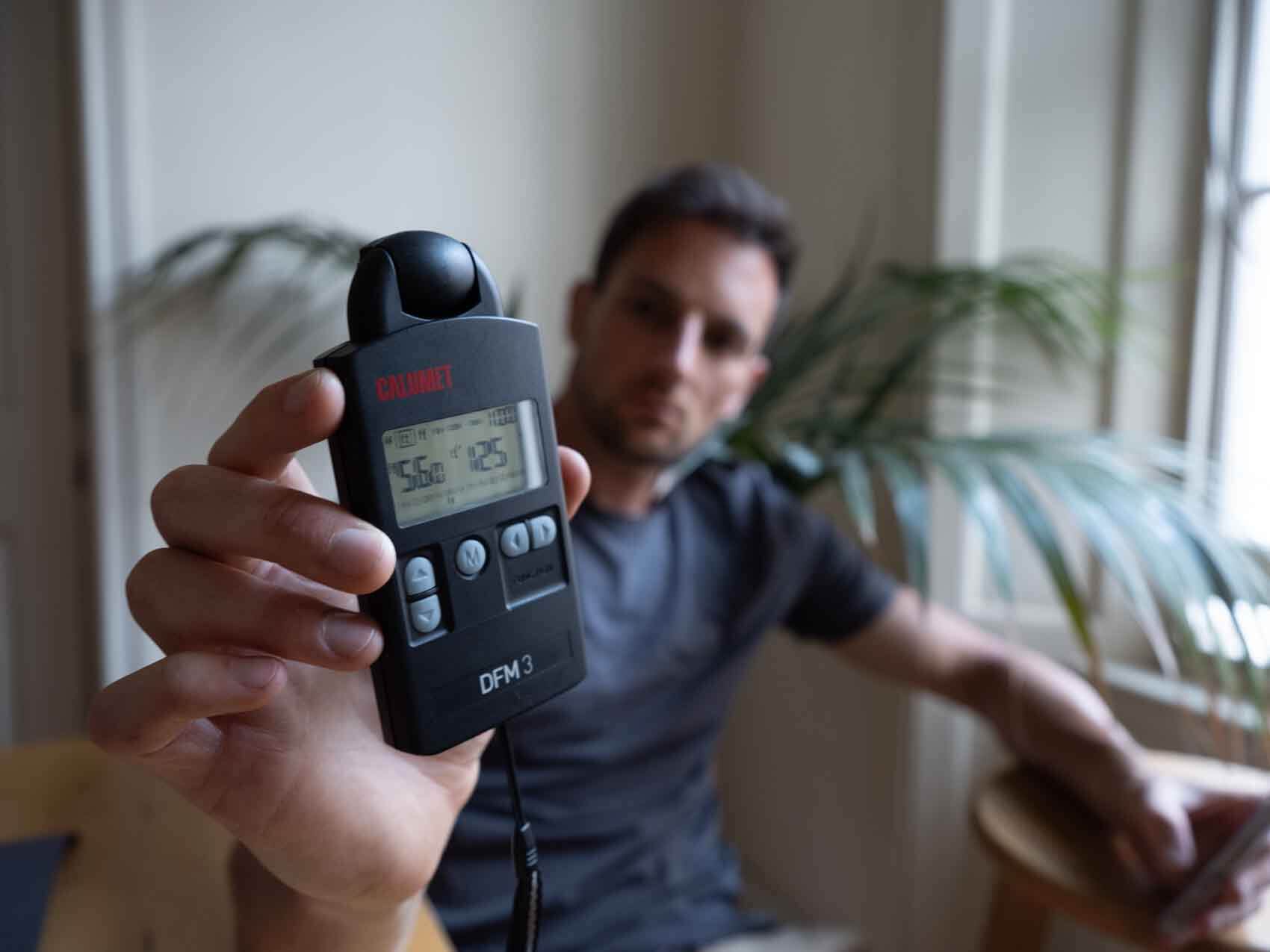 A photographer using the light meter