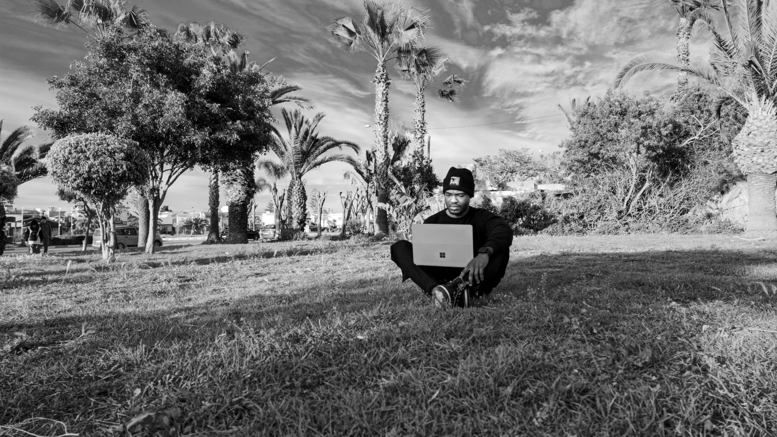 Samuel G. Sumo sitting on grass