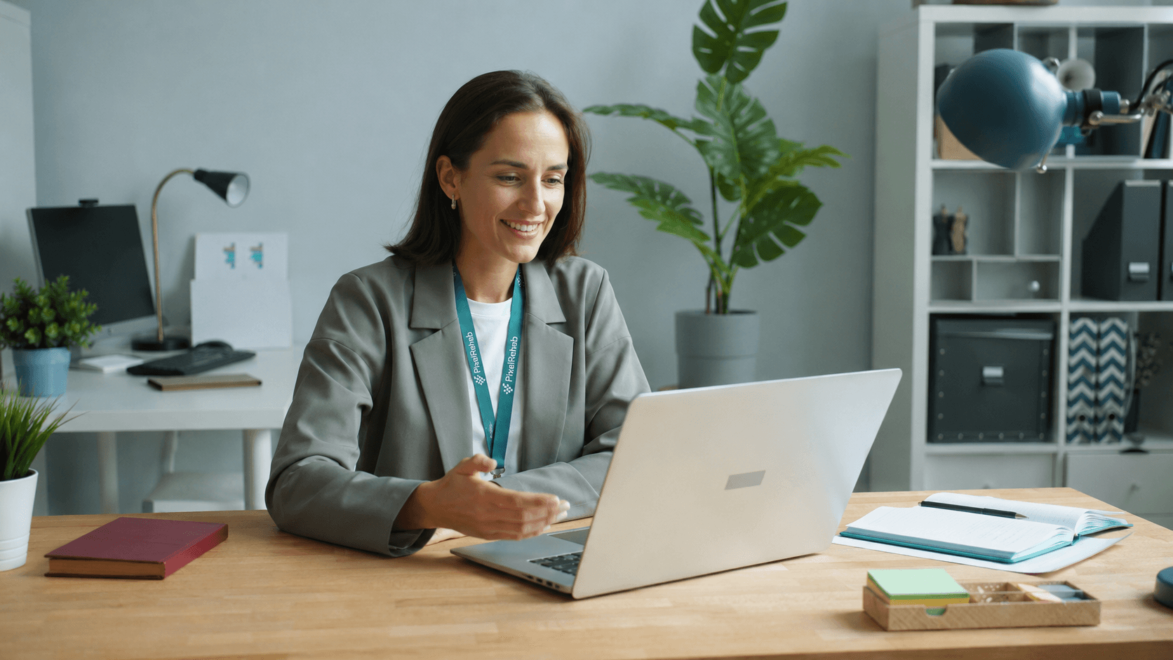 Physiotherapist reviewing patient information during online consultation