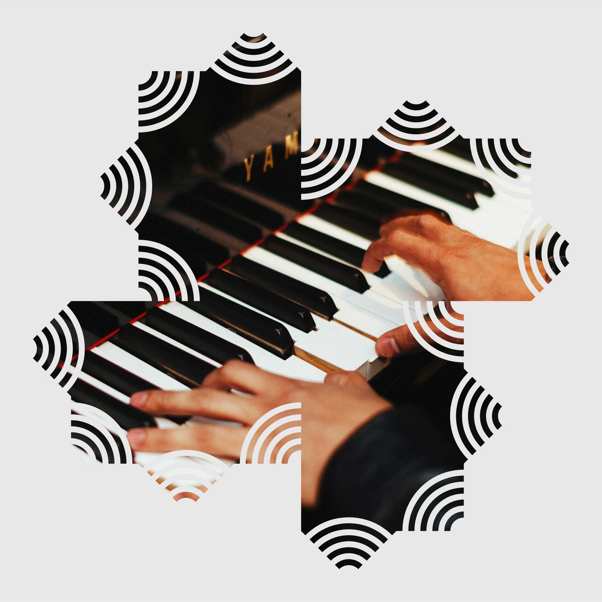An individual plays a grand piano with black and white keys, overlaid with logo patterns of 'Atmosphere Studios', creating a harmonious blend of music and modern design.