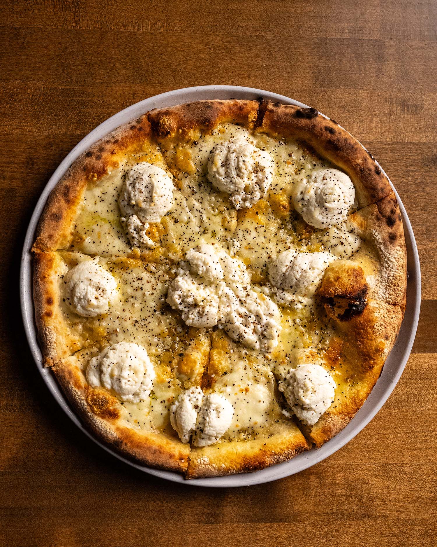 Wooden Paddle Pretty Fly For A White Pie ricotta gorgonzola pizza overhead La Grange IL