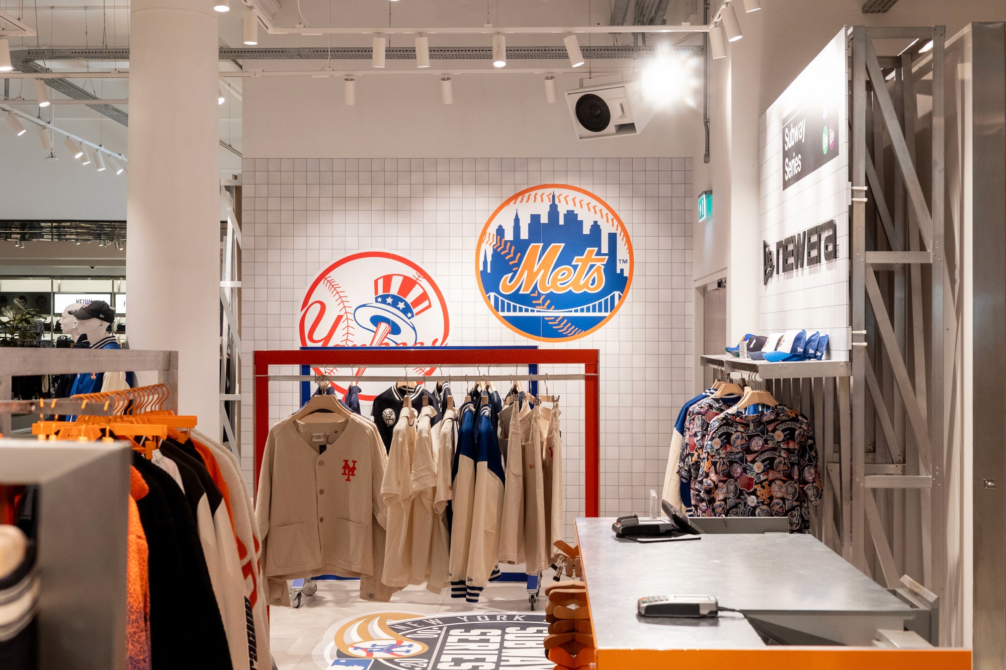 Experiential retail pop-up featuring sports apparel displays, branded graphics, custom merchandising fixtures and immersive activation design