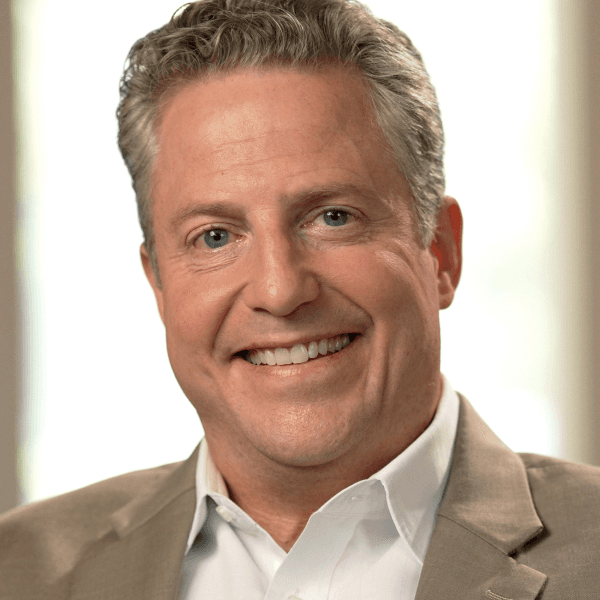 Portrait of Dr. Aaron Wells, healthcare economist and founder of Parallel Health Analytics, specializing in value based care analytics and contracting strategy.
