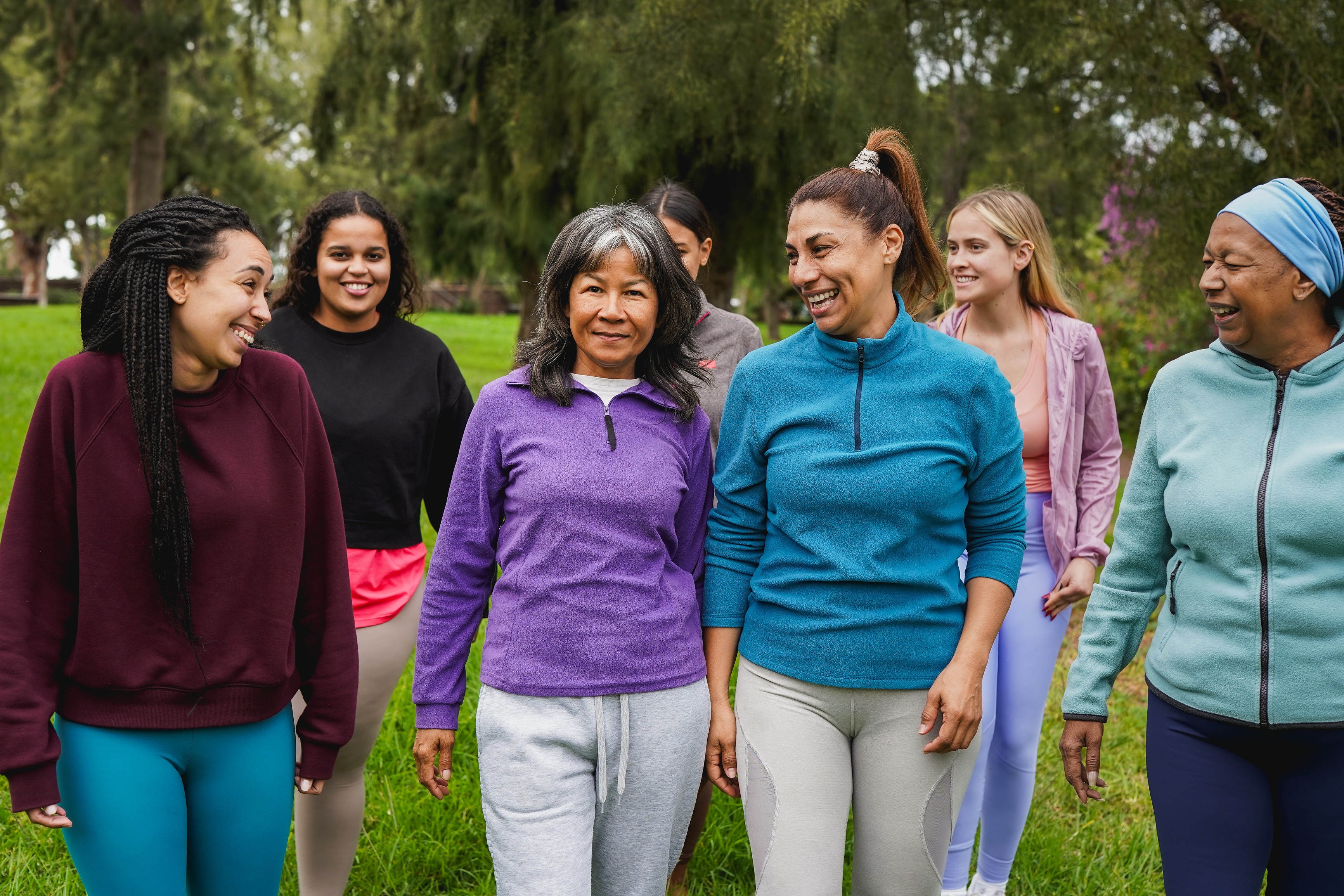 Diverse group of women smiling outdoors