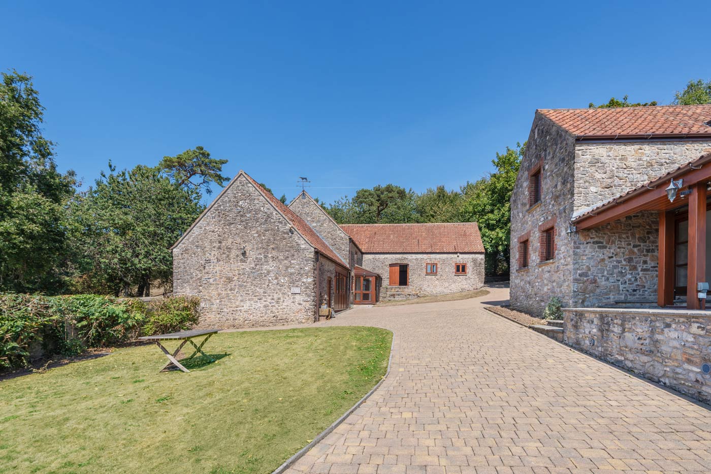 stone courtyard and driveway between converted barns