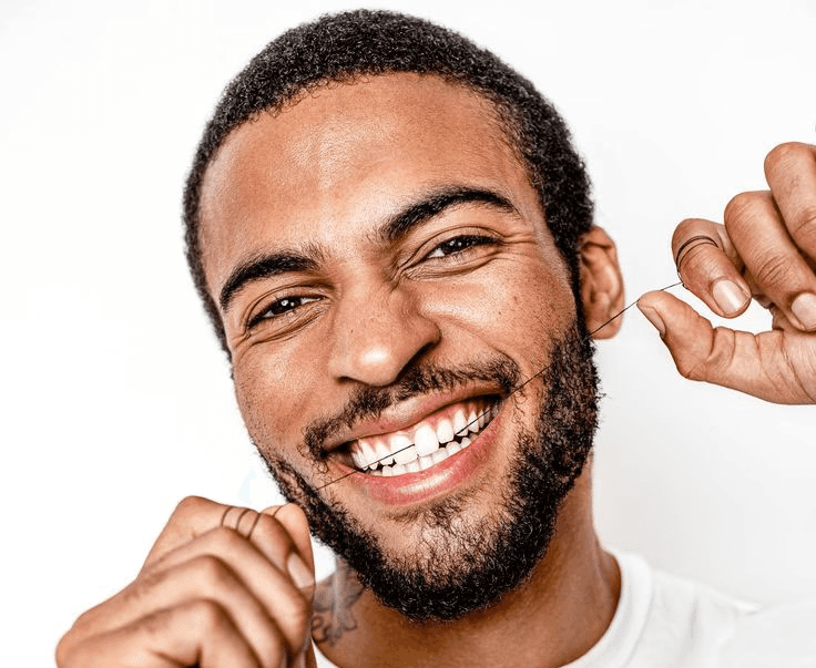 Beautiful woman smiling with her hands on her cheeks