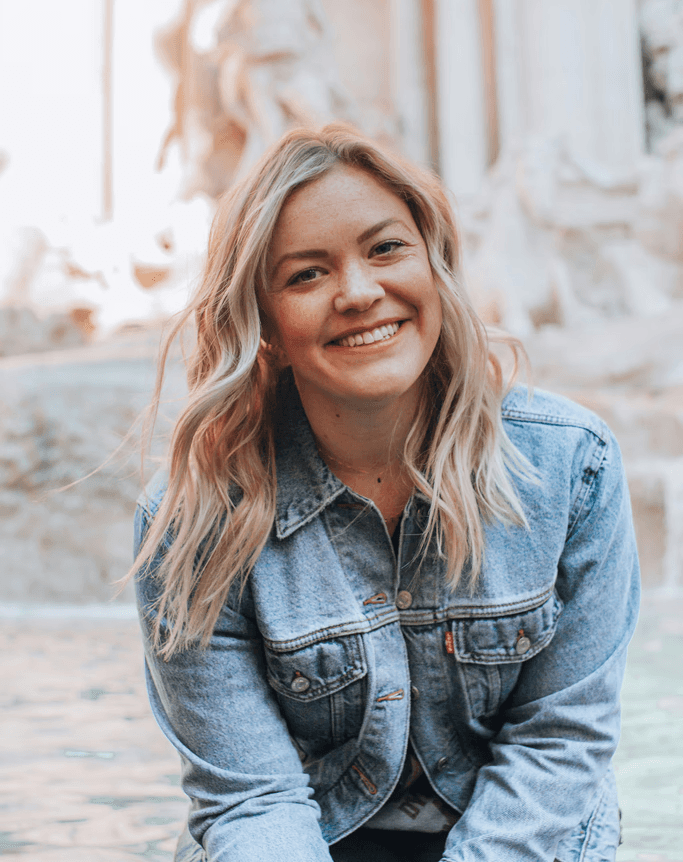 woman smiling wearing denim jacket