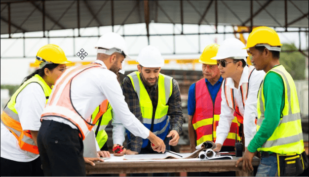 Construction Workers Discussing a Blueprint
