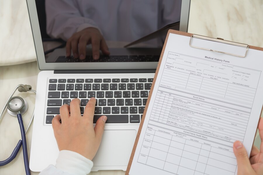 A doctor matching his records with the reports of his patient.