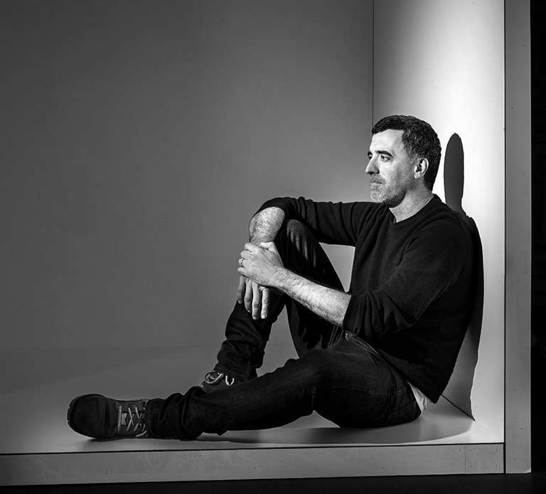 Rustic cabin in a golden field at sunset