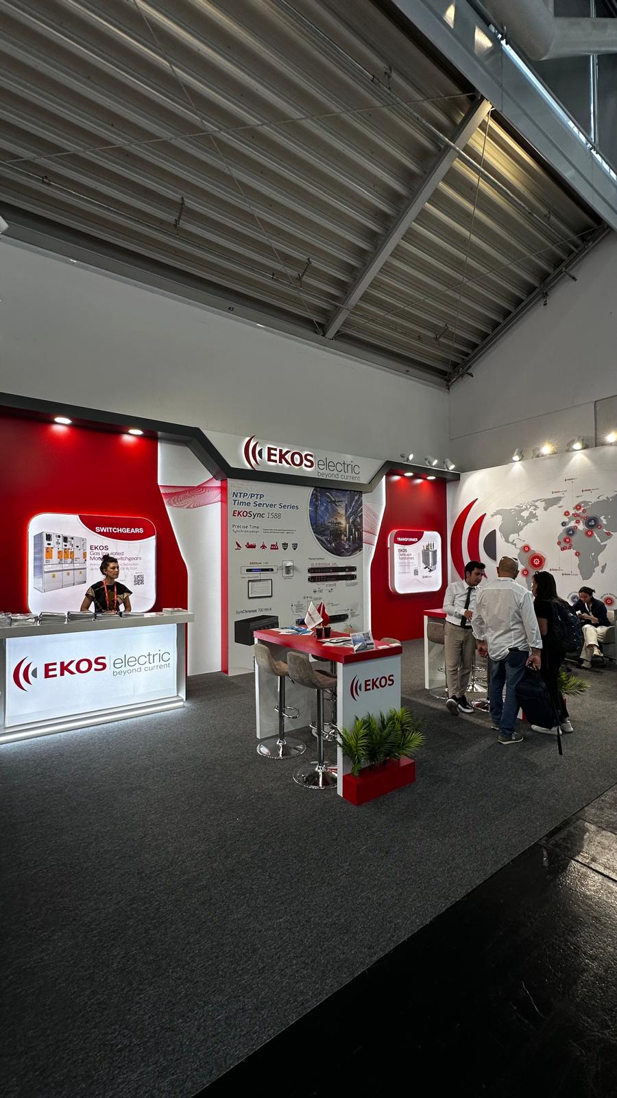 Open meeting and collaboration area at the EKOS Electric stand, designed for business conversations and technical discussions.