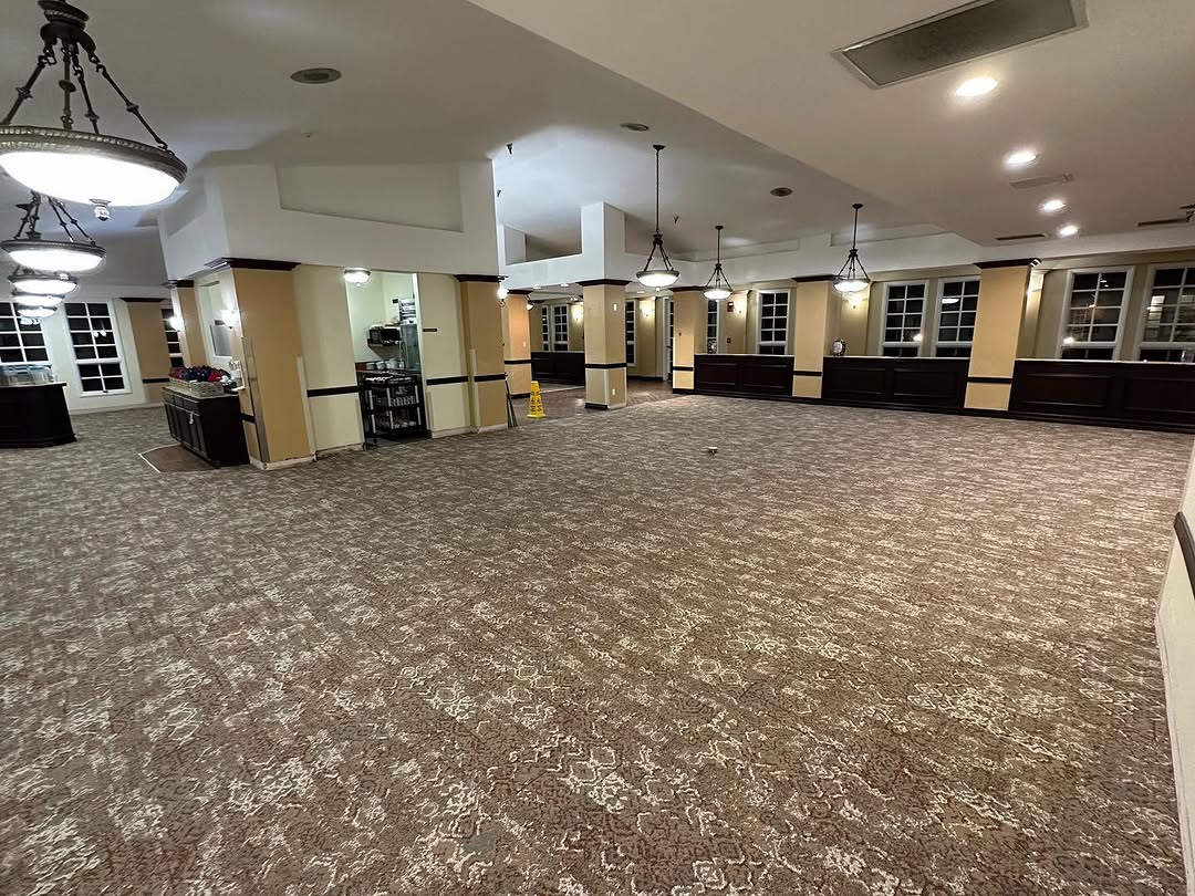 Finished carpet tile floor through a dining hall