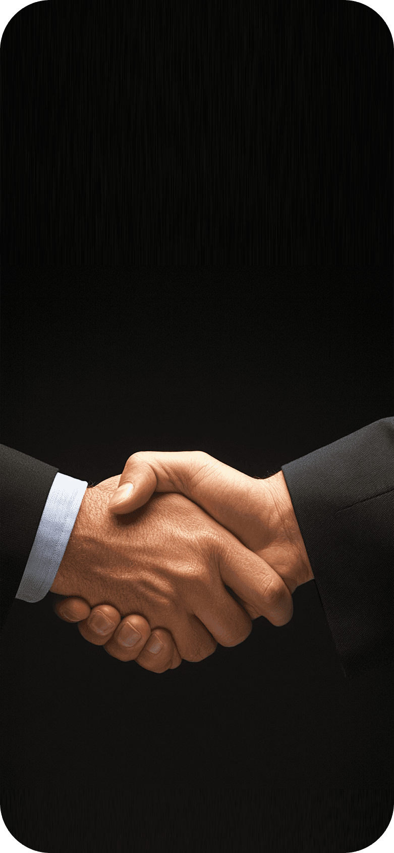 Two men shaking hands as fireworks go off in celebration