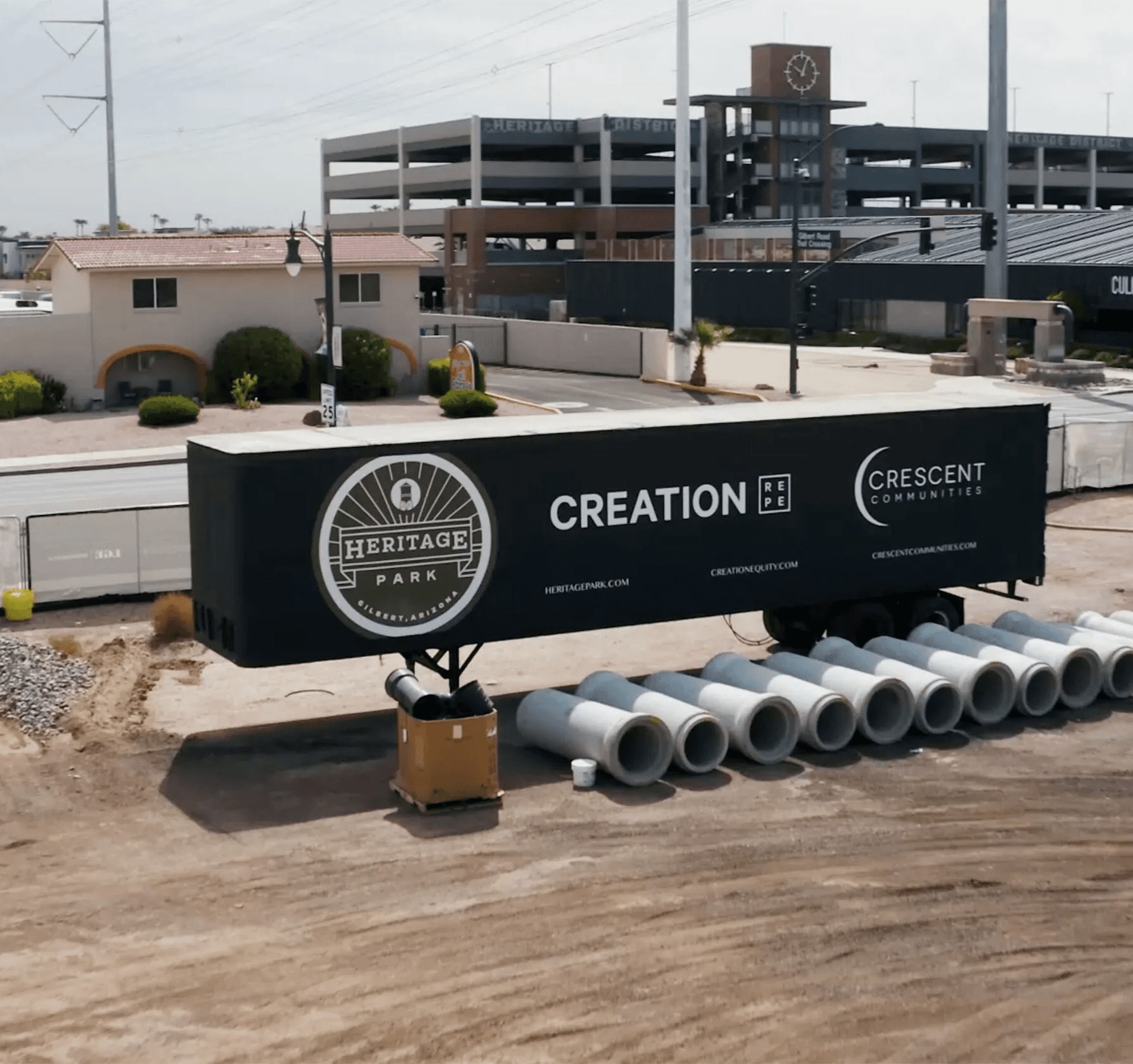 Heritage Park construction site in Gilbert, Arizona with a Creation and Crescent Communities jobsite trailer