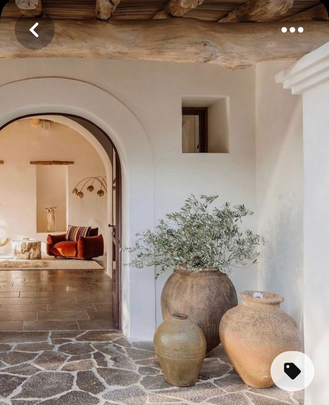 Two silhouetted figures are seen in a softly lit room, engaged in conversation, with sunlight filtering through a window.