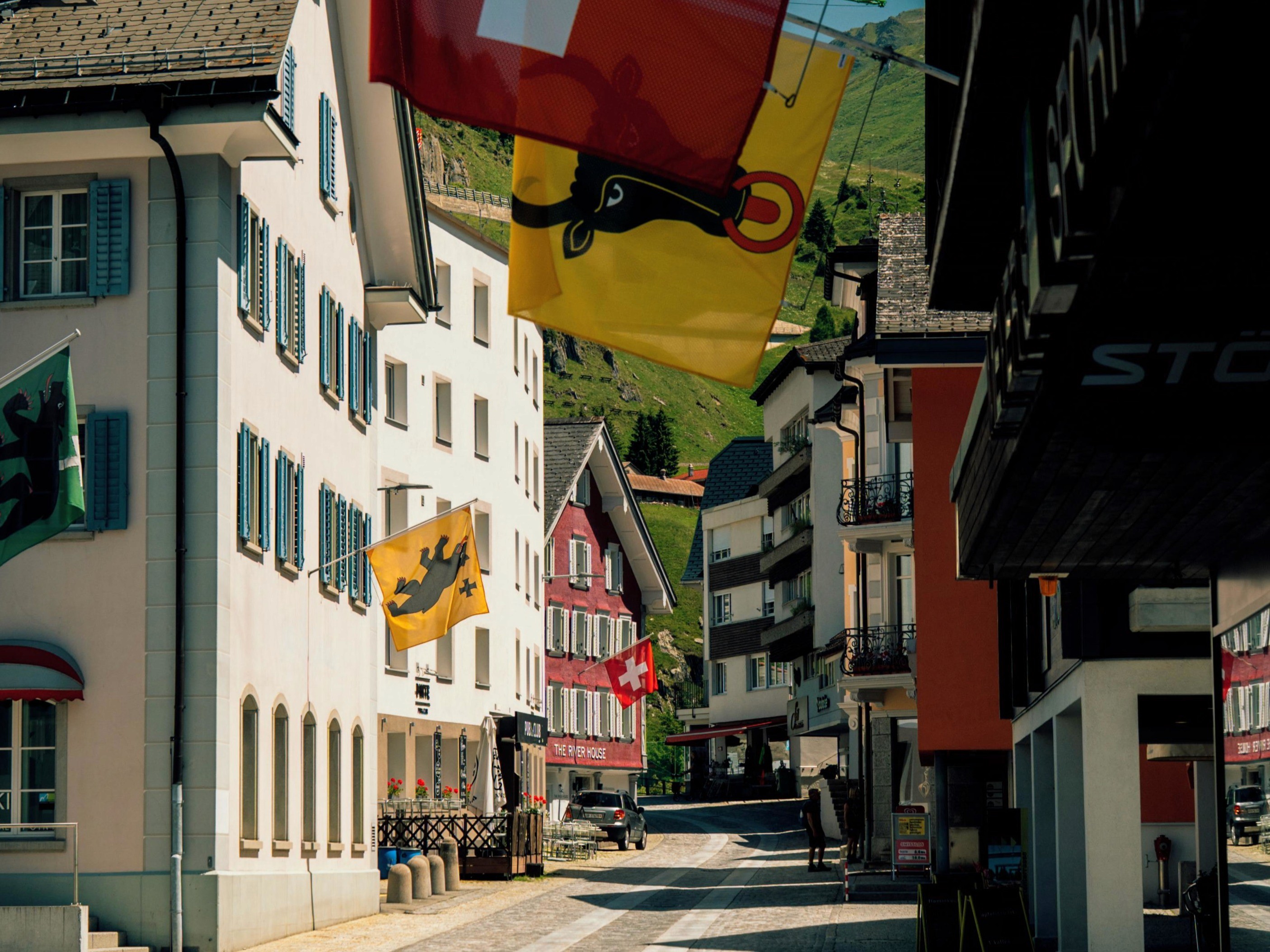 Andermat town centre with various colourful flags