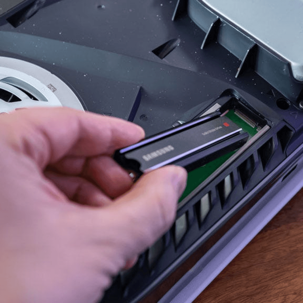 How To Add More PS5 Storage: Install a Second SSD, slot and align the SDD in the expansion slot