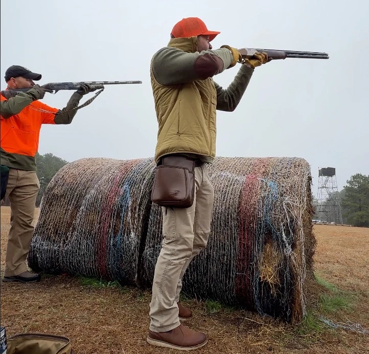 Hunters in an outdoor field setting