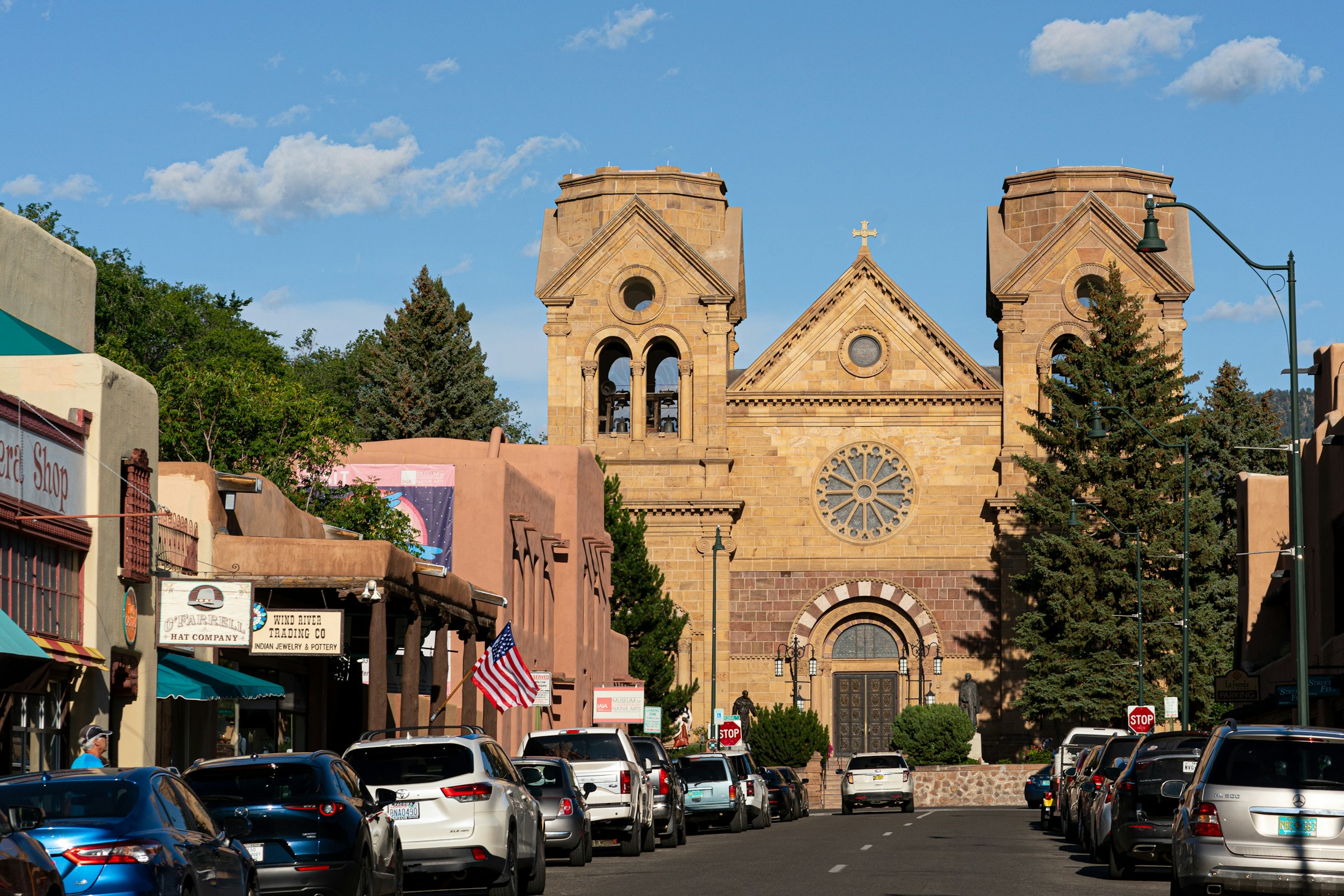 Santa Fe Cathedral Basilica of St. Francis of Assisi facade with adobe-style architecture against a clear blue sky