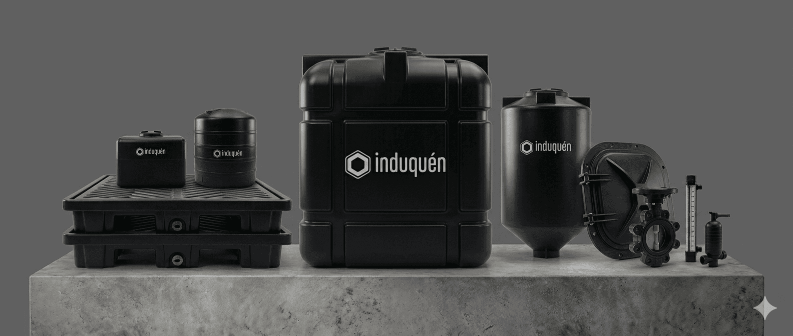 A smiling young man with crossed arms, wearing a plaid shirt and white t-shirt, poses against a dark background.