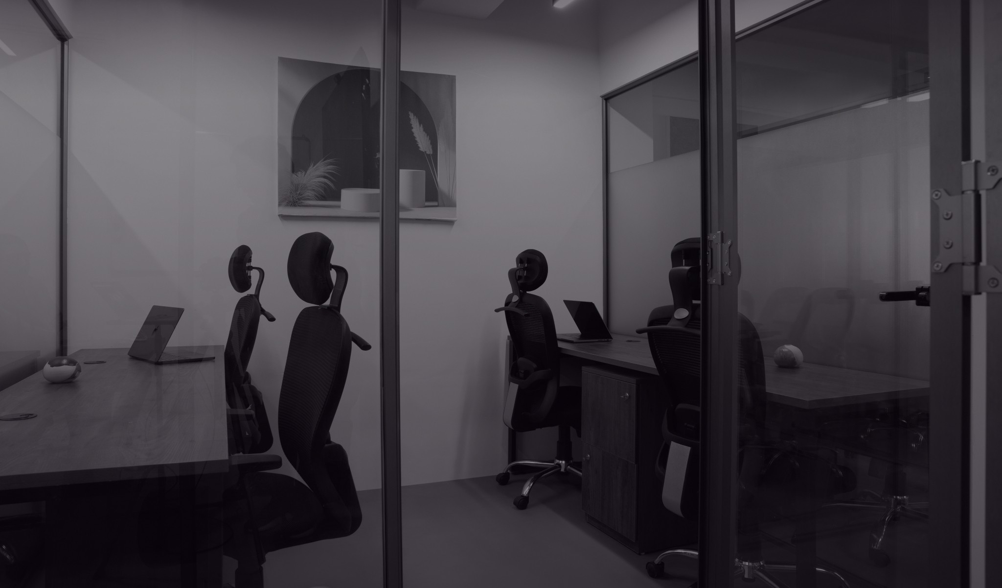 A restaurant interior featuring marble countertops, brown leather chairs, wood-paneled walls, and round pendant lights hanging above a bar set with wine glasses.