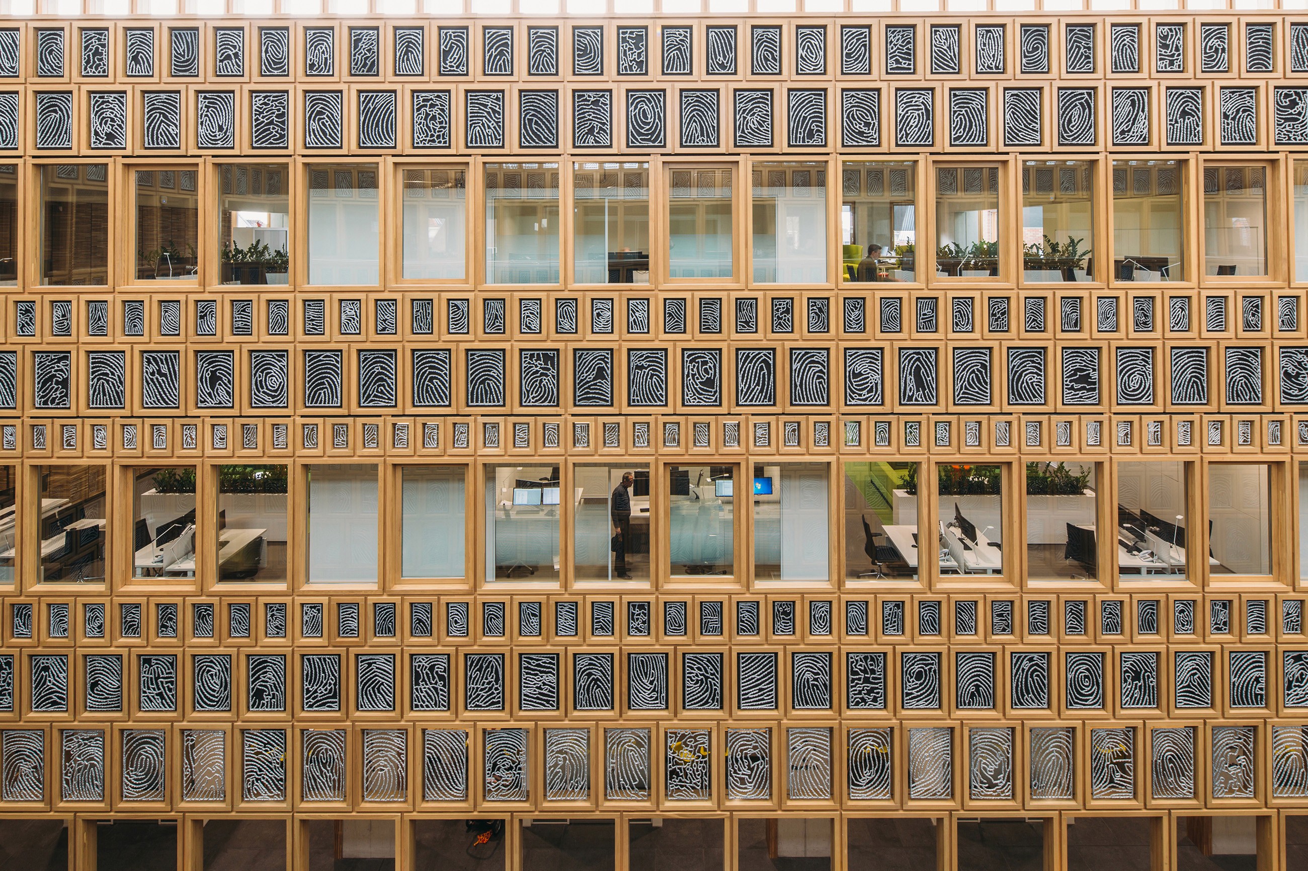 Interior photo of the main hall in the city hall of Deventer, showing the work areas of administrative departments