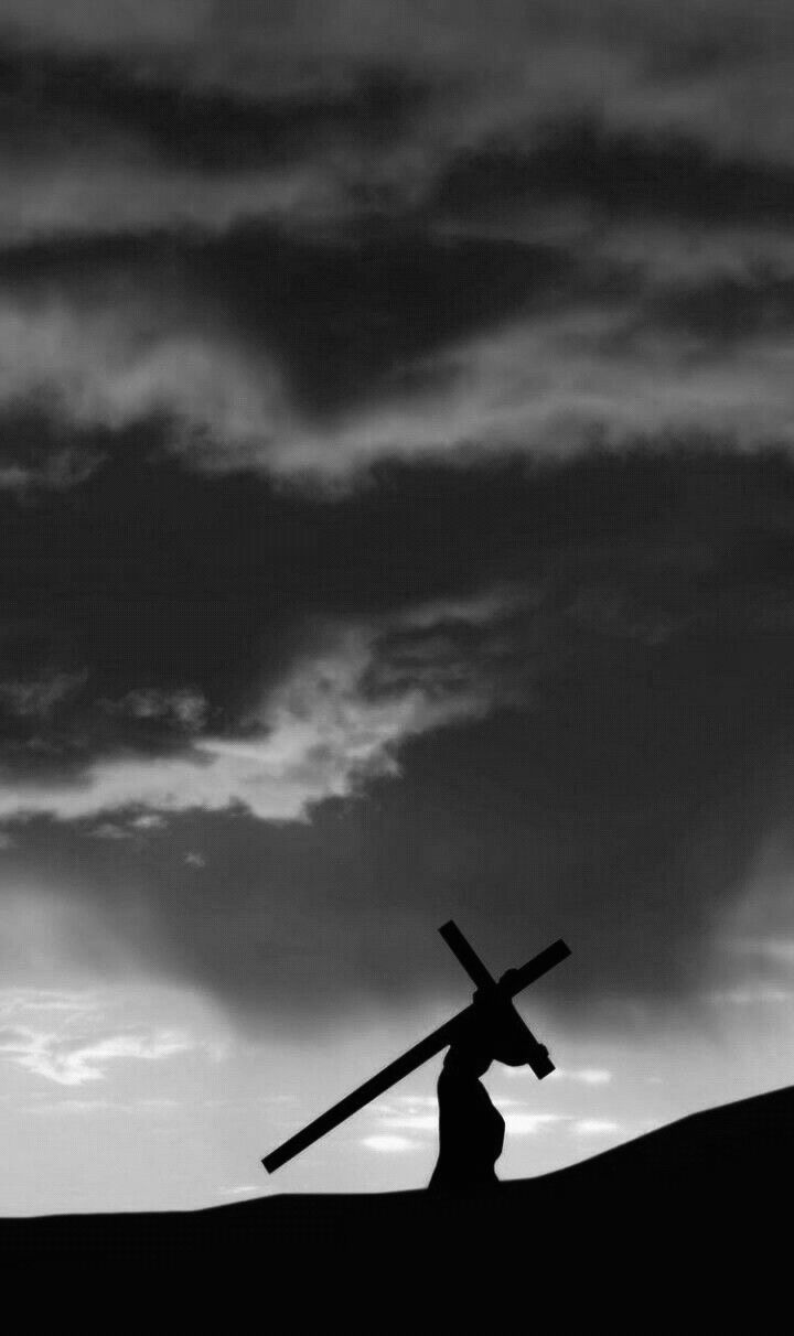 White building with red lighthouse under clear sky.