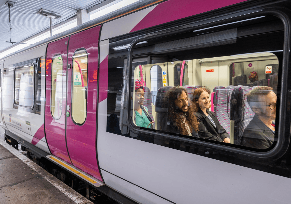c2c branded train filled with people at a train station