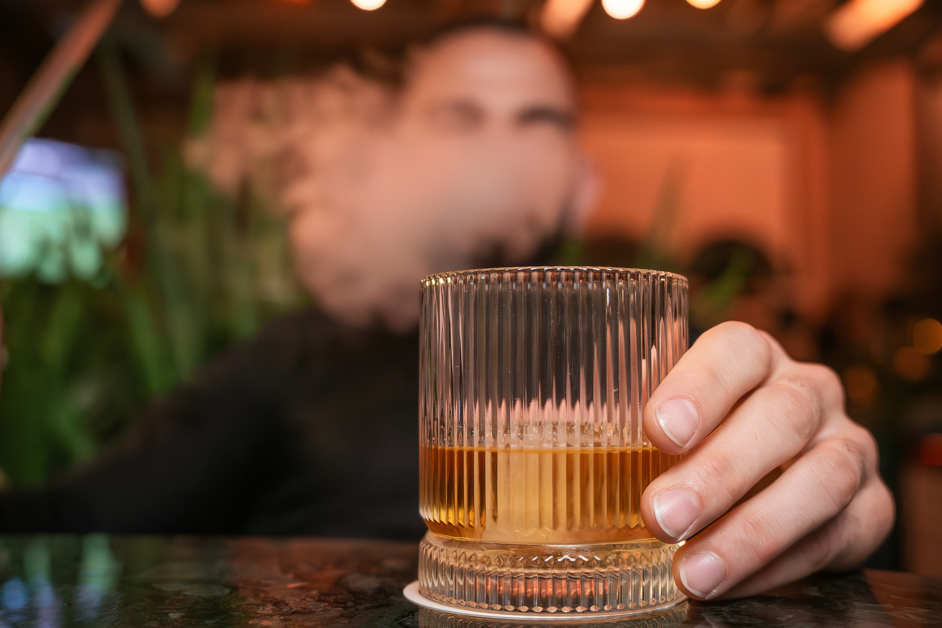 man wearing brown knit crew-neck sweater