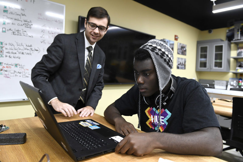 Hu teacher guiding a student