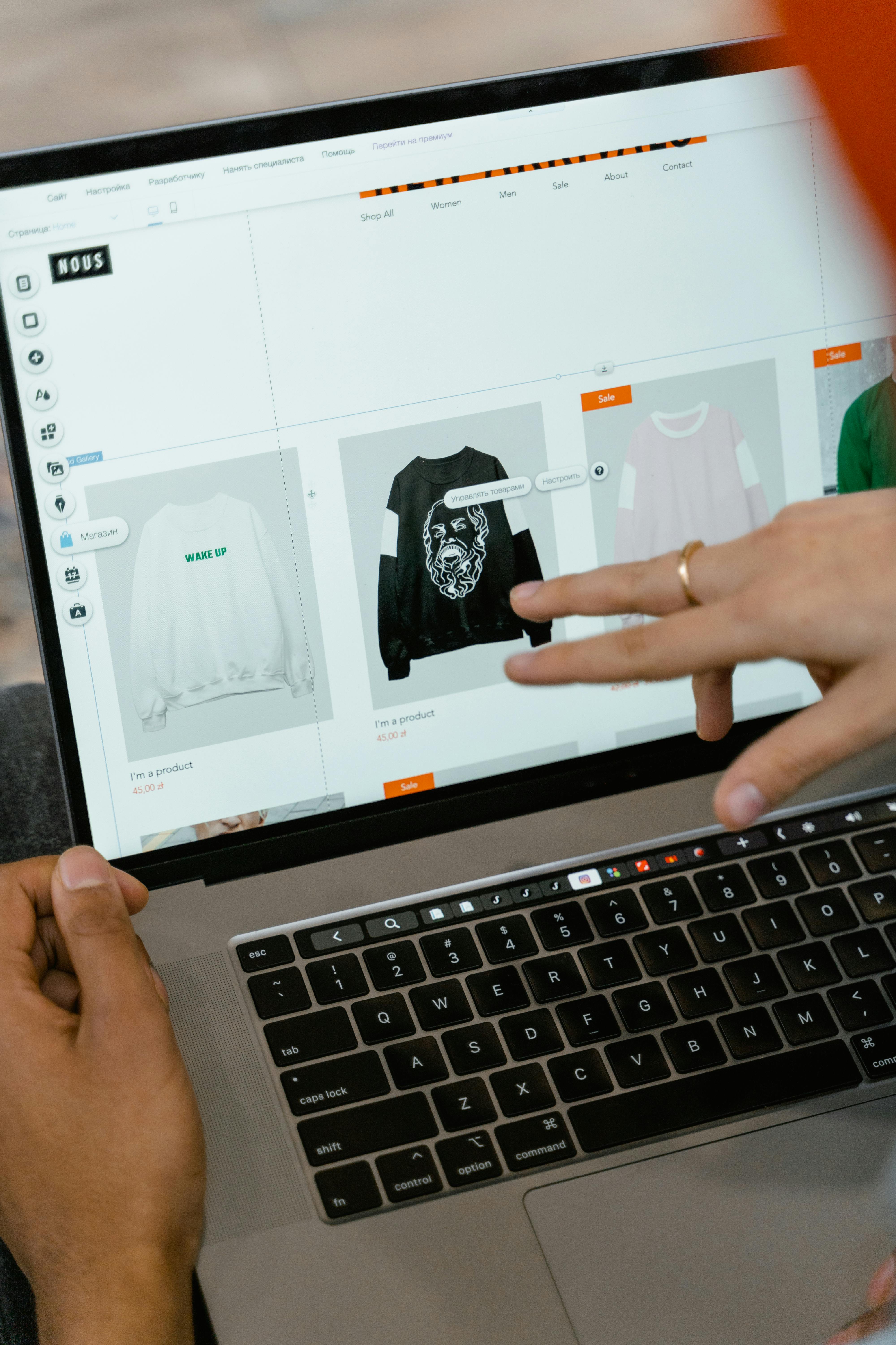 black laptop computer on white textile