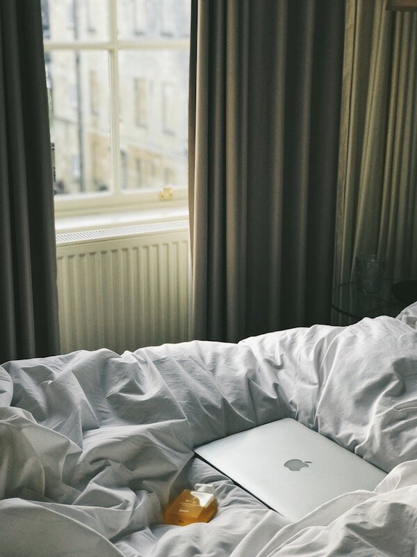  macbook on bed at no15 bath hotel 