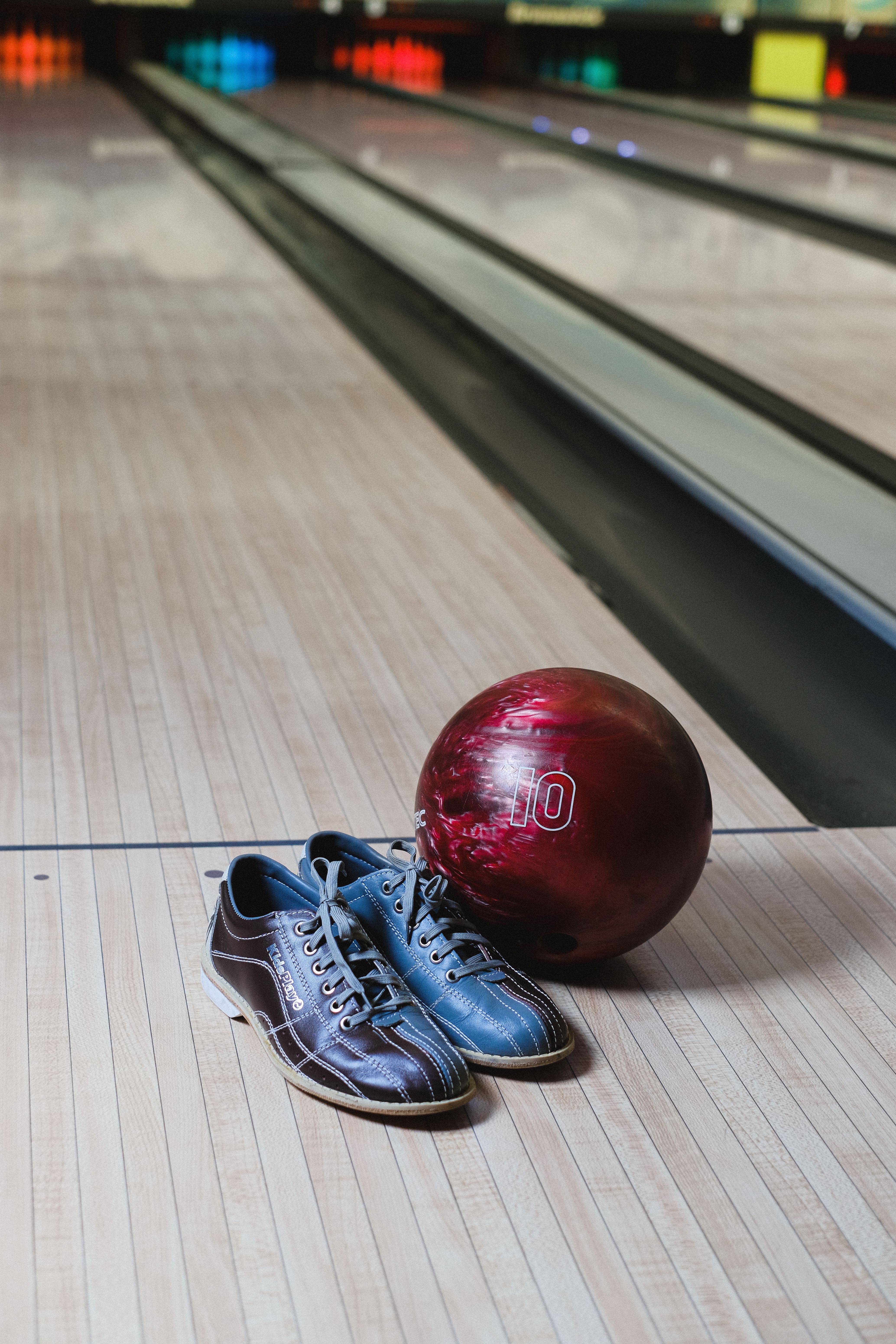Illustrative bowling shoes and ball; not Timber Lanes or this particular event.