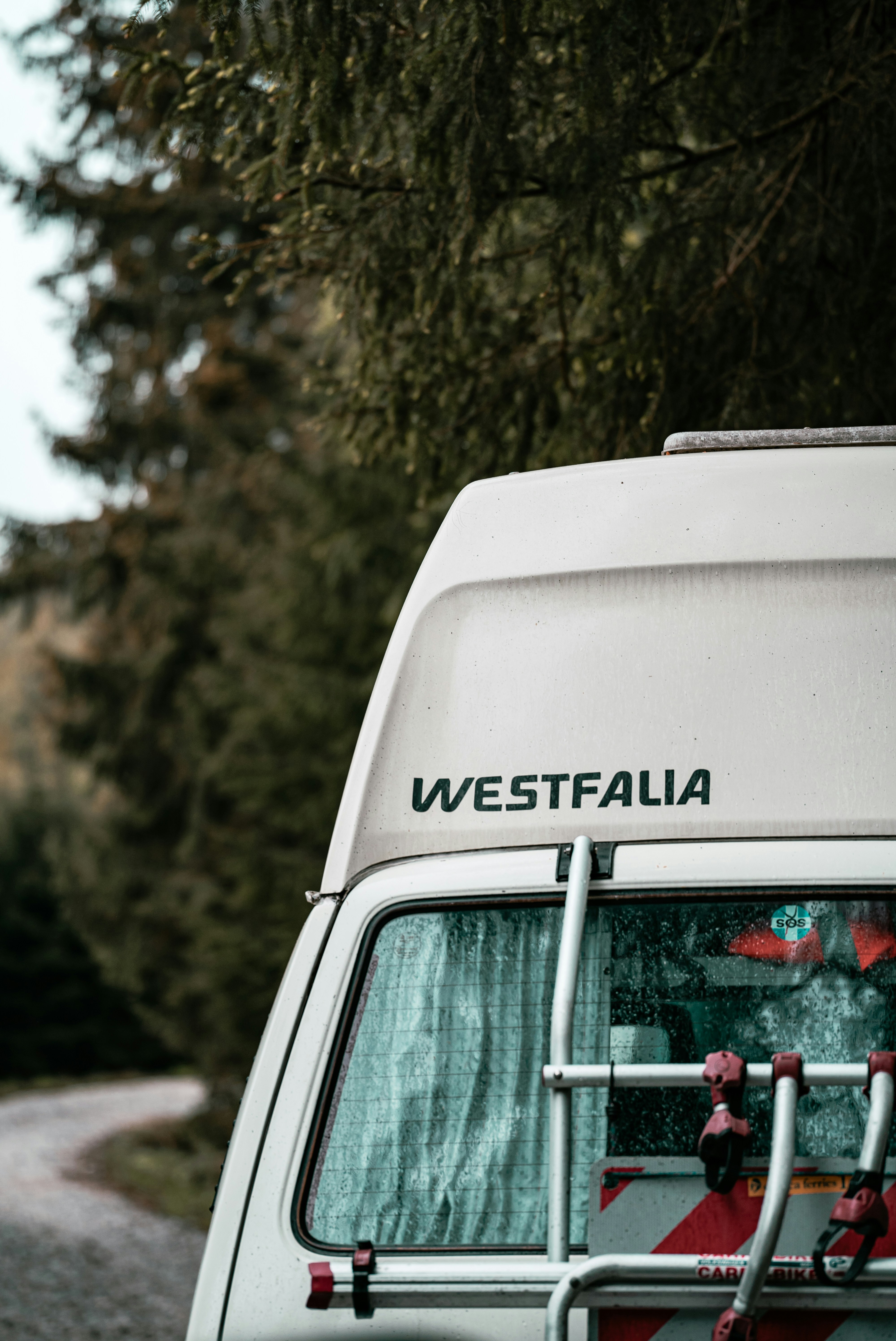 A man holding a cocktail in a dimly lit bar
