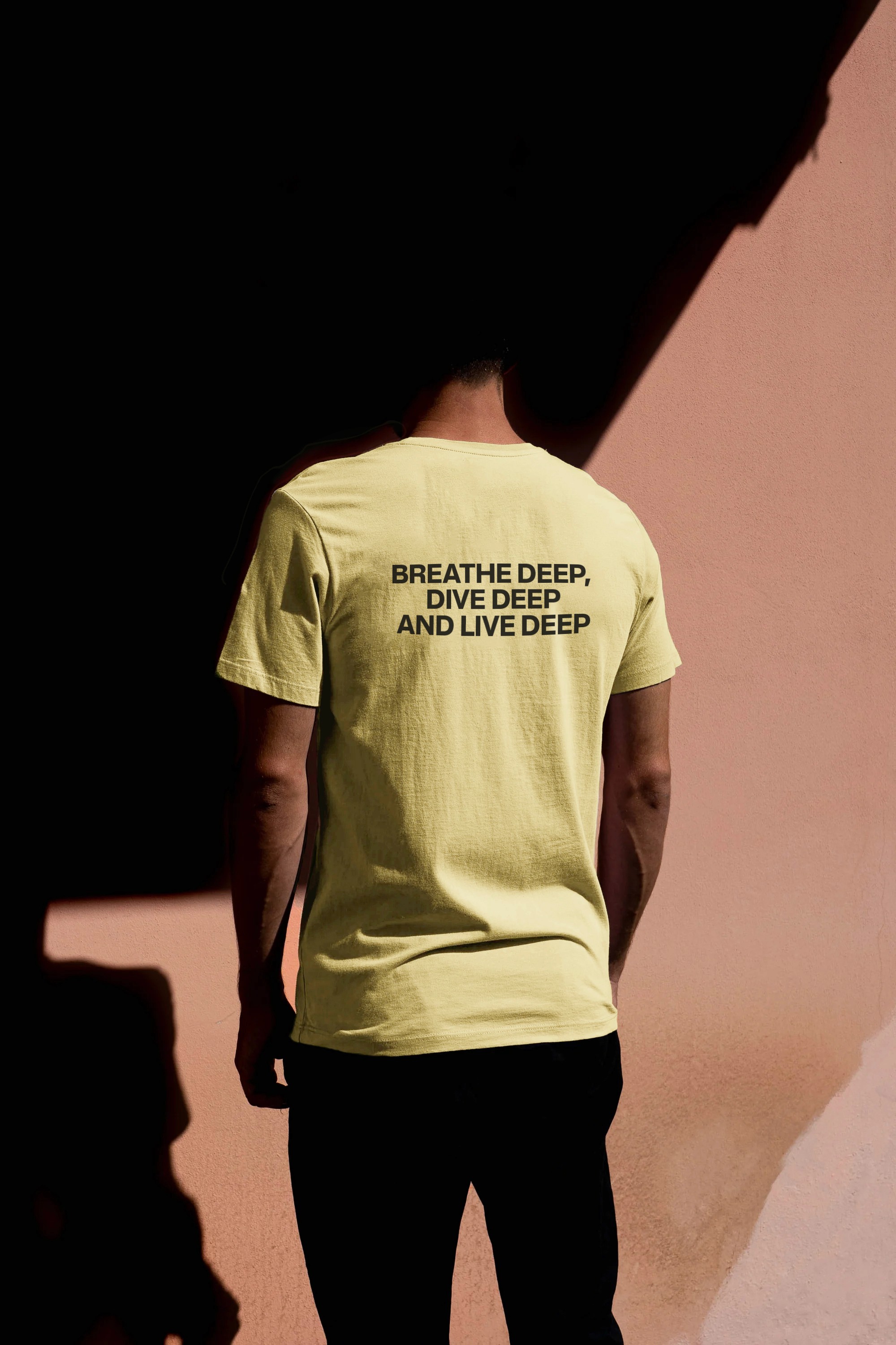 Yellow The Salty t-shirt printed with the quote "Breathe deep, dive deep, live deep".