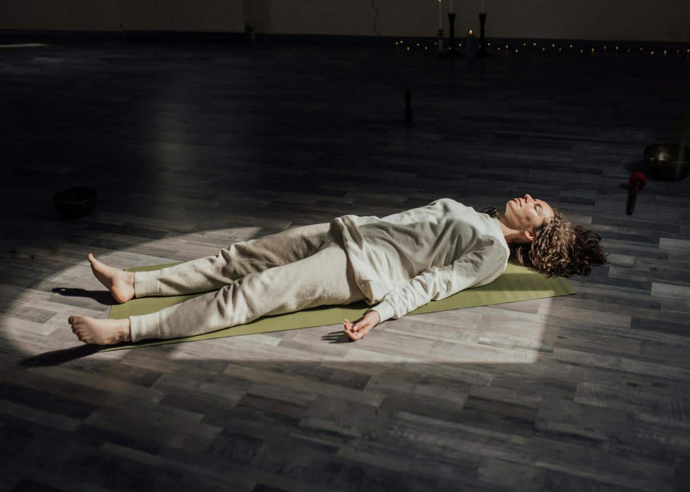 Restorative yoga explained - woman lying on a yoga mat