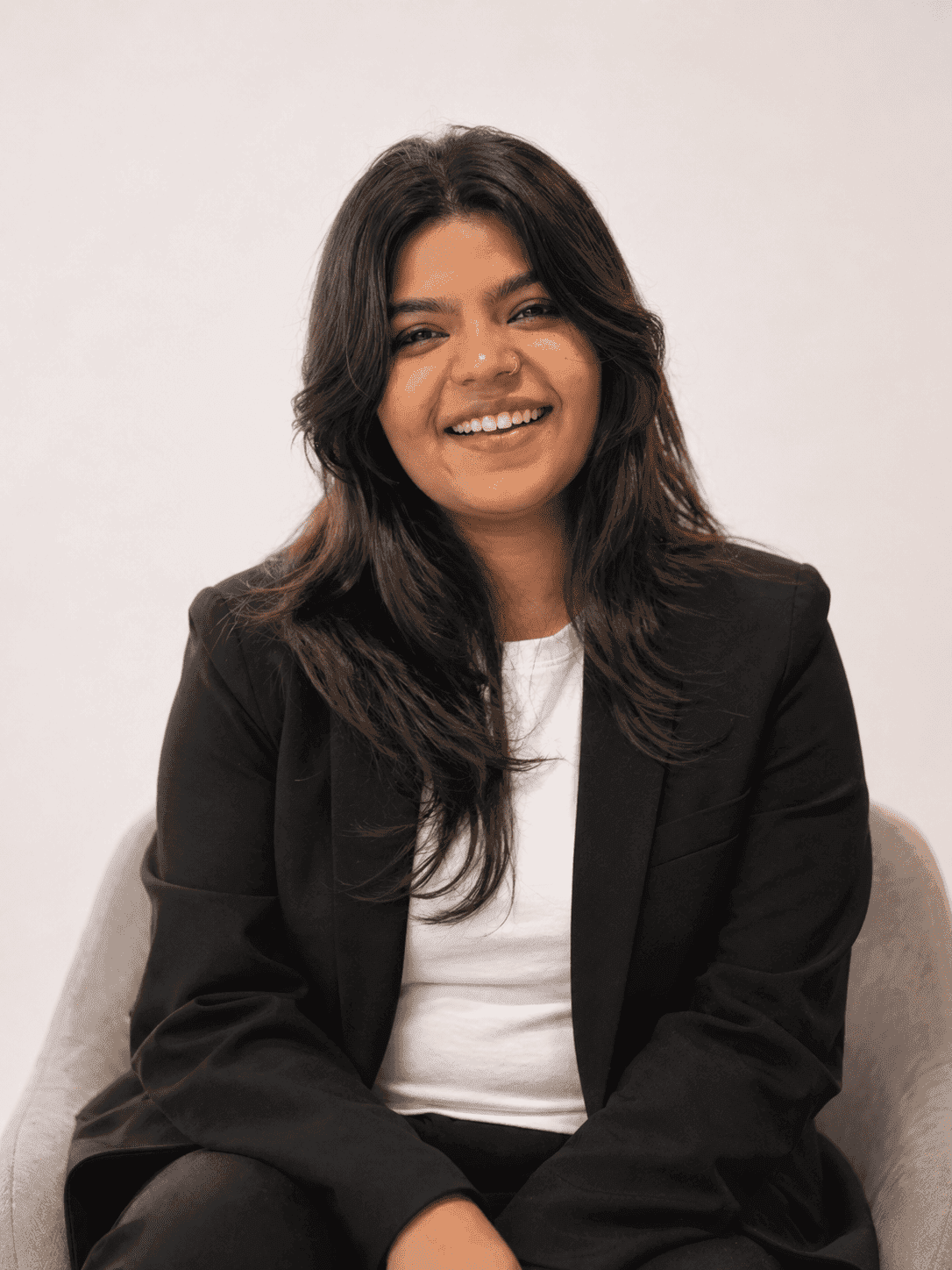 Eeshani Sharma, Talent and Growth Specialist, smiling in a modern office