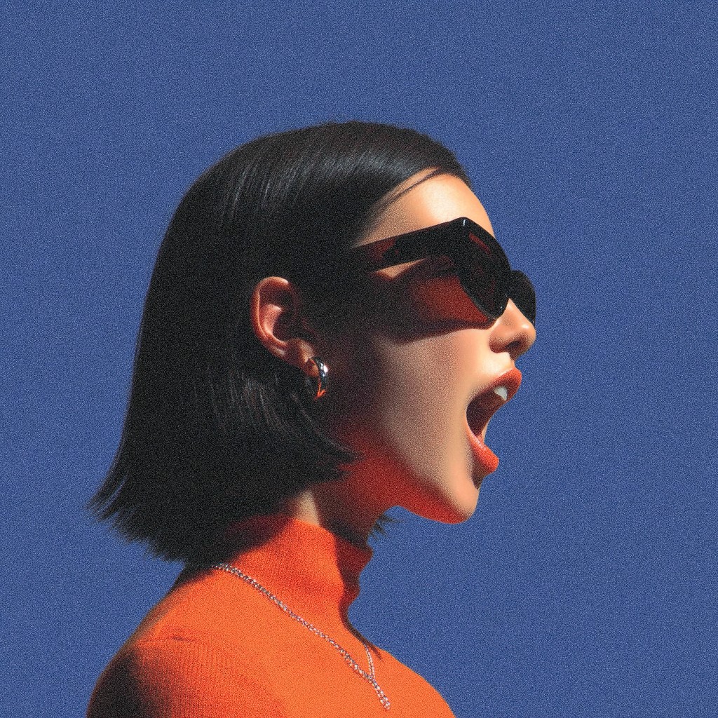 A woman in an orange top and dark sunglasses is shown in profile against a blue background, her mouth open and face dramatically lit.