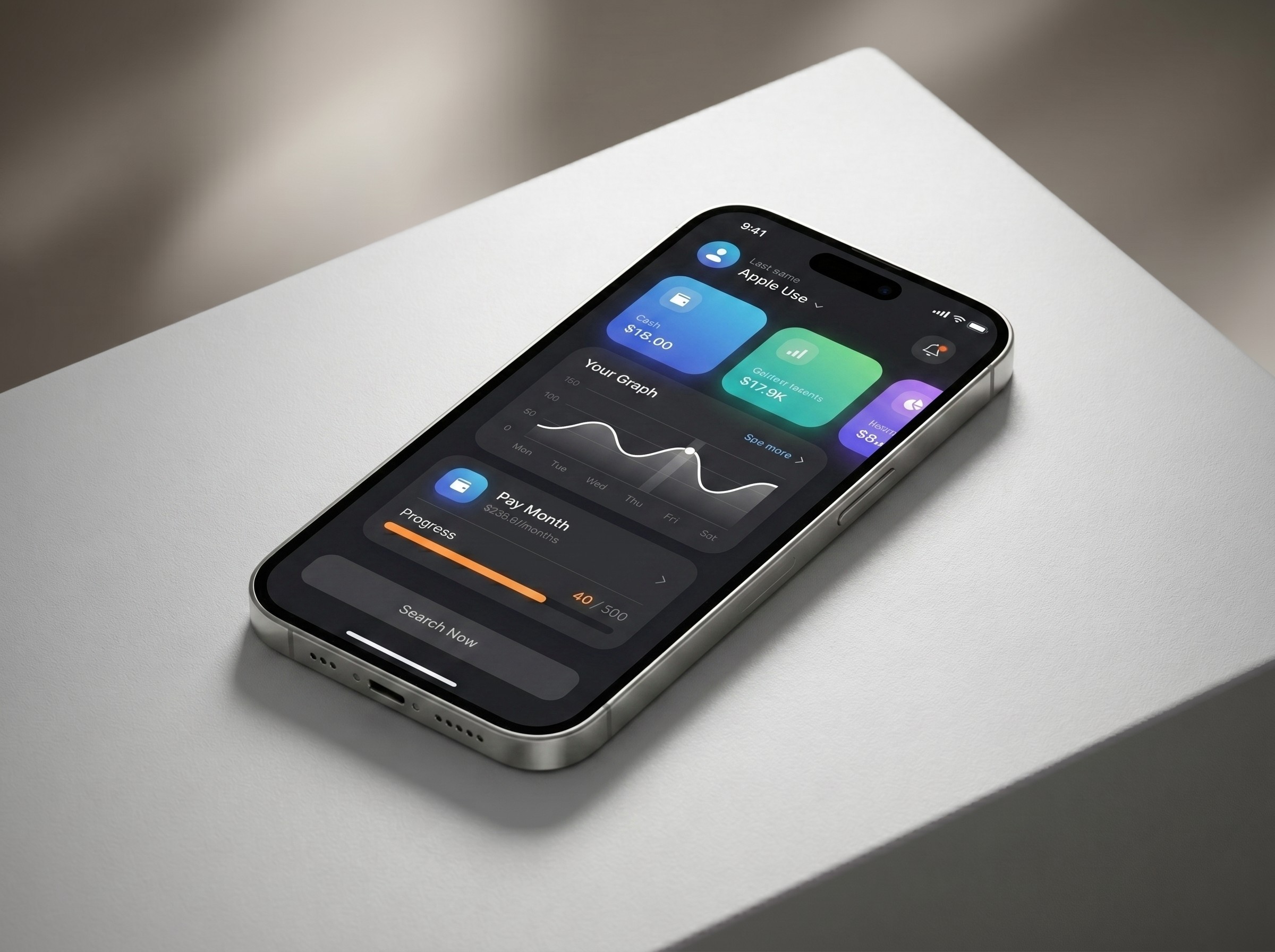 Smartphone on a white surface showing a sleek dark-mode finance app with line graphs, balances, and colorful cards.