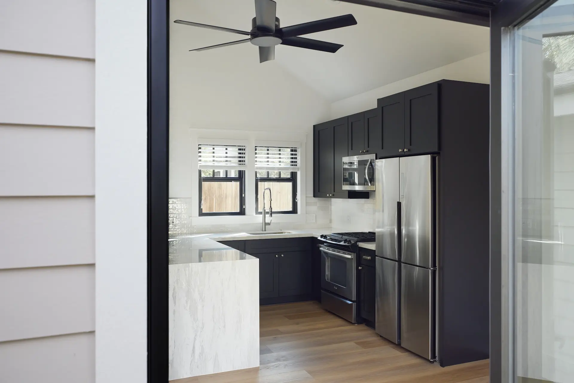 Wide shot of the rear entrance of the ADU in Orange, blending traditional Craftsman design with modern functionality. Photo by Todd Huge.