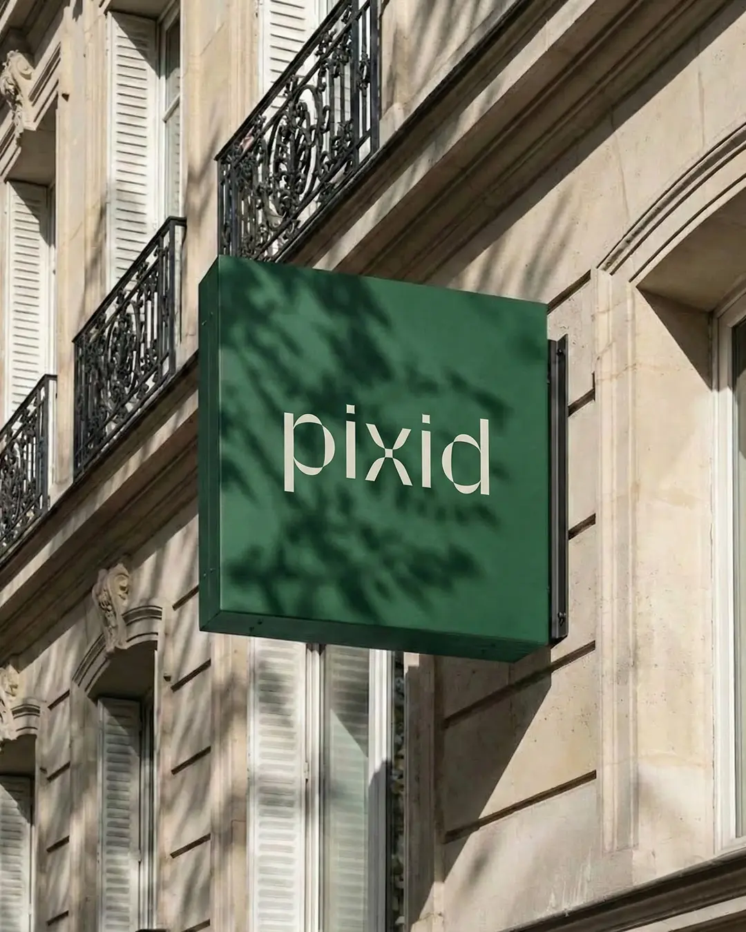 Pixid signage mockup — logo on building-mounted sign, AI-powered outdoor branding mockup