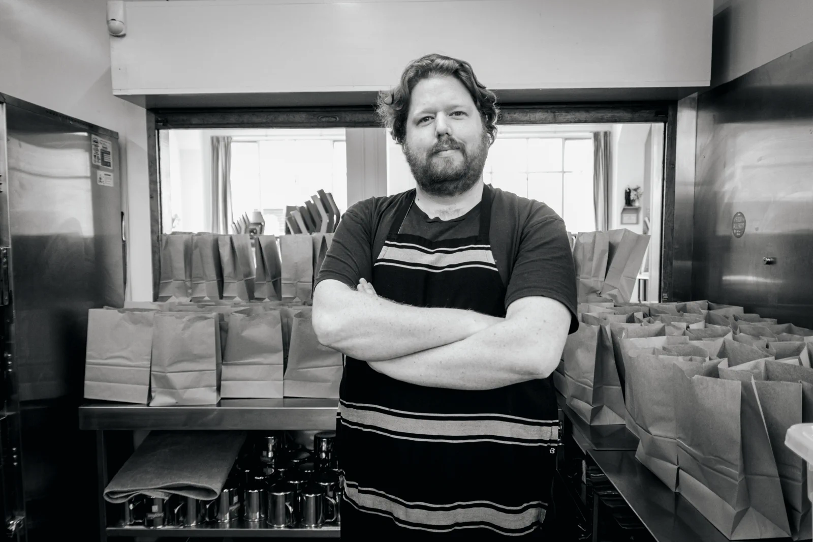 Black and white portrait of a soup kitchen worker