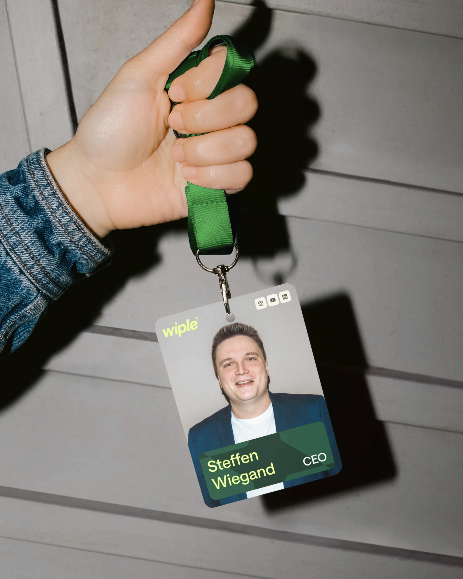 Female hand holding lanyard