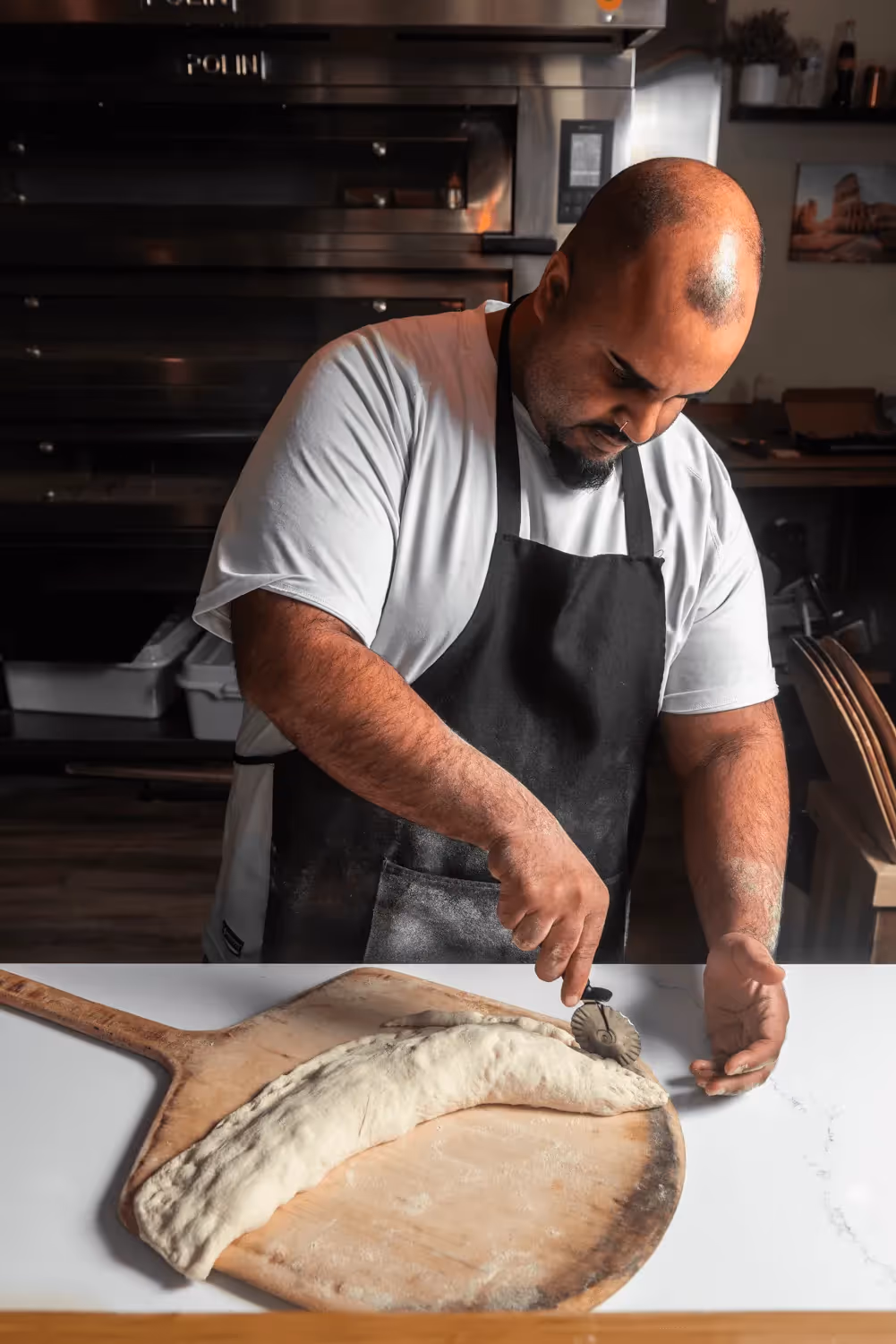 Elevated Pizza brand photography featuring people in a professional setting brand application