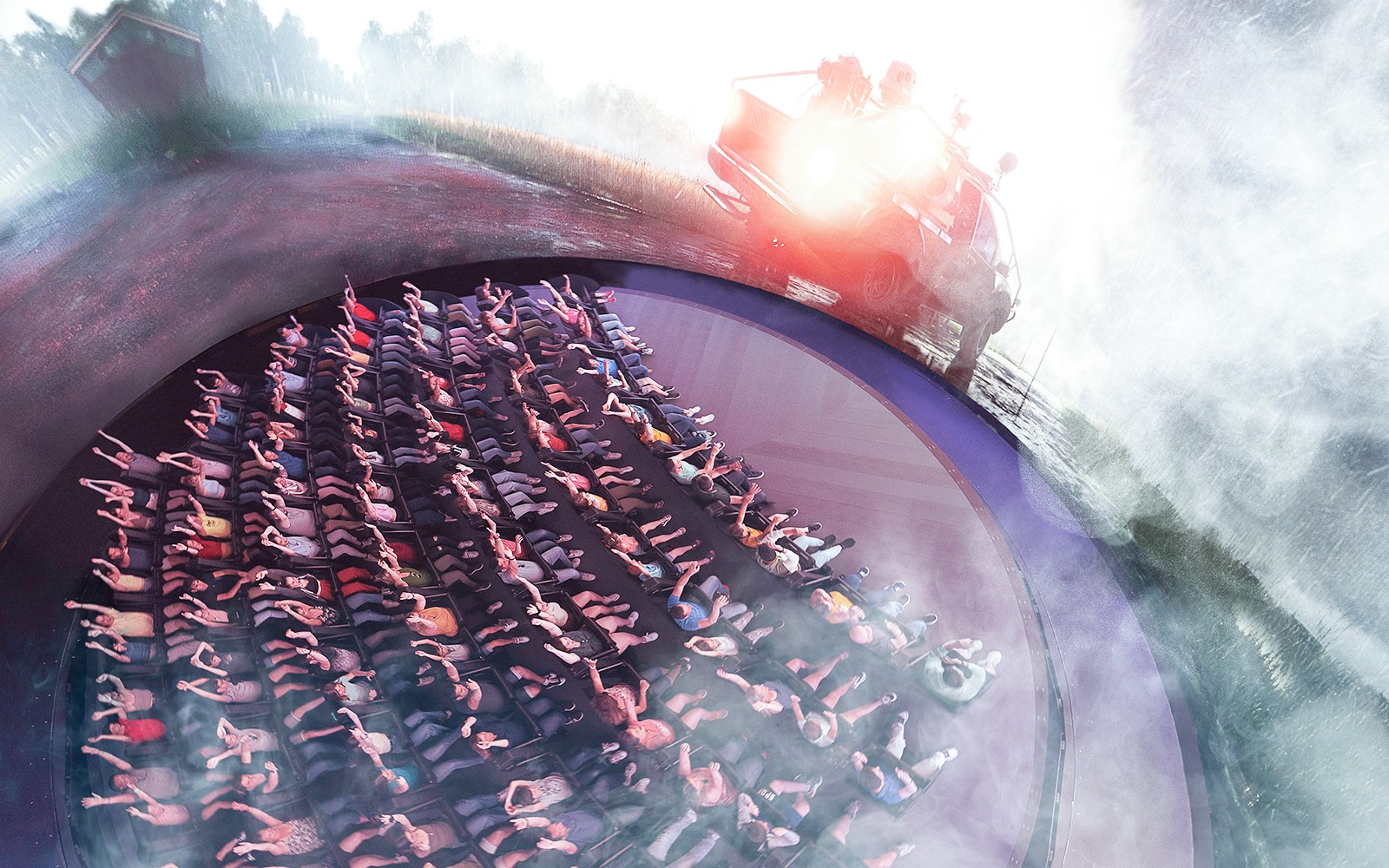 Visitors experiencing Tornado Chasers attraction at Futuroscope with immersive effects.