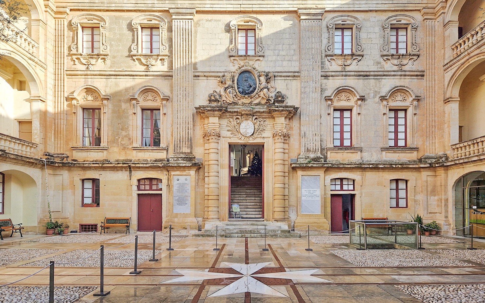 Mdina historic building facade with ornate architecture on guided tour.
