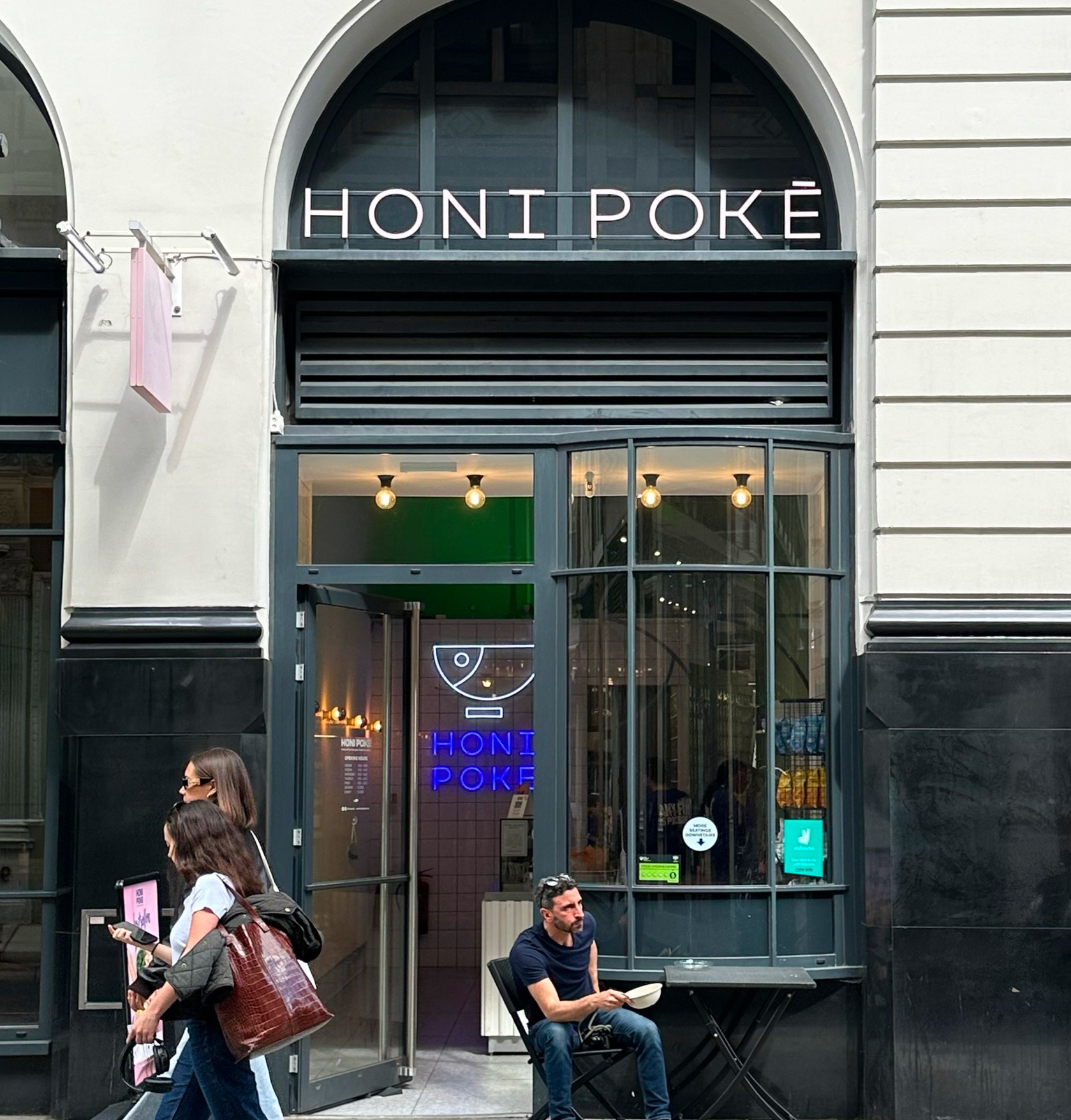 Modern building corner with dark glass windows