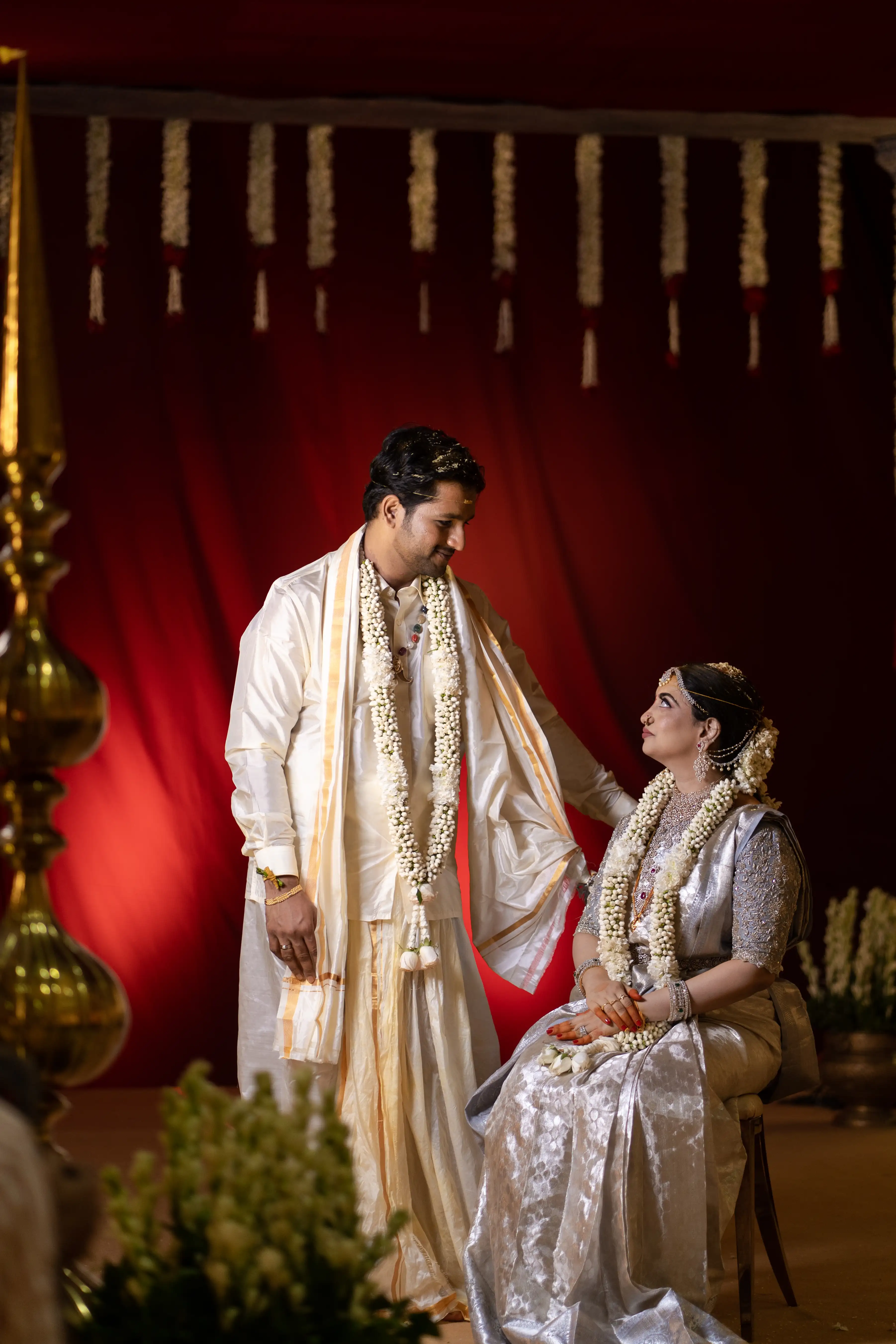 Priya and Vamsi gaze lovingly at each other, captured beautifully by Out of The Blues Fine Art Wedding Photography in Hyderabad.